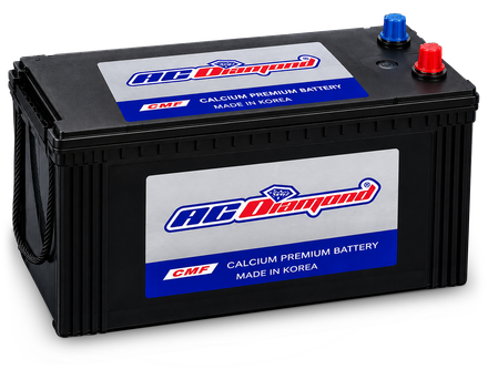 AC Diamond battery: a black case with silver and blue AC Diamond labels on the lid and the front, and a red + terminal beside a blue − terminal